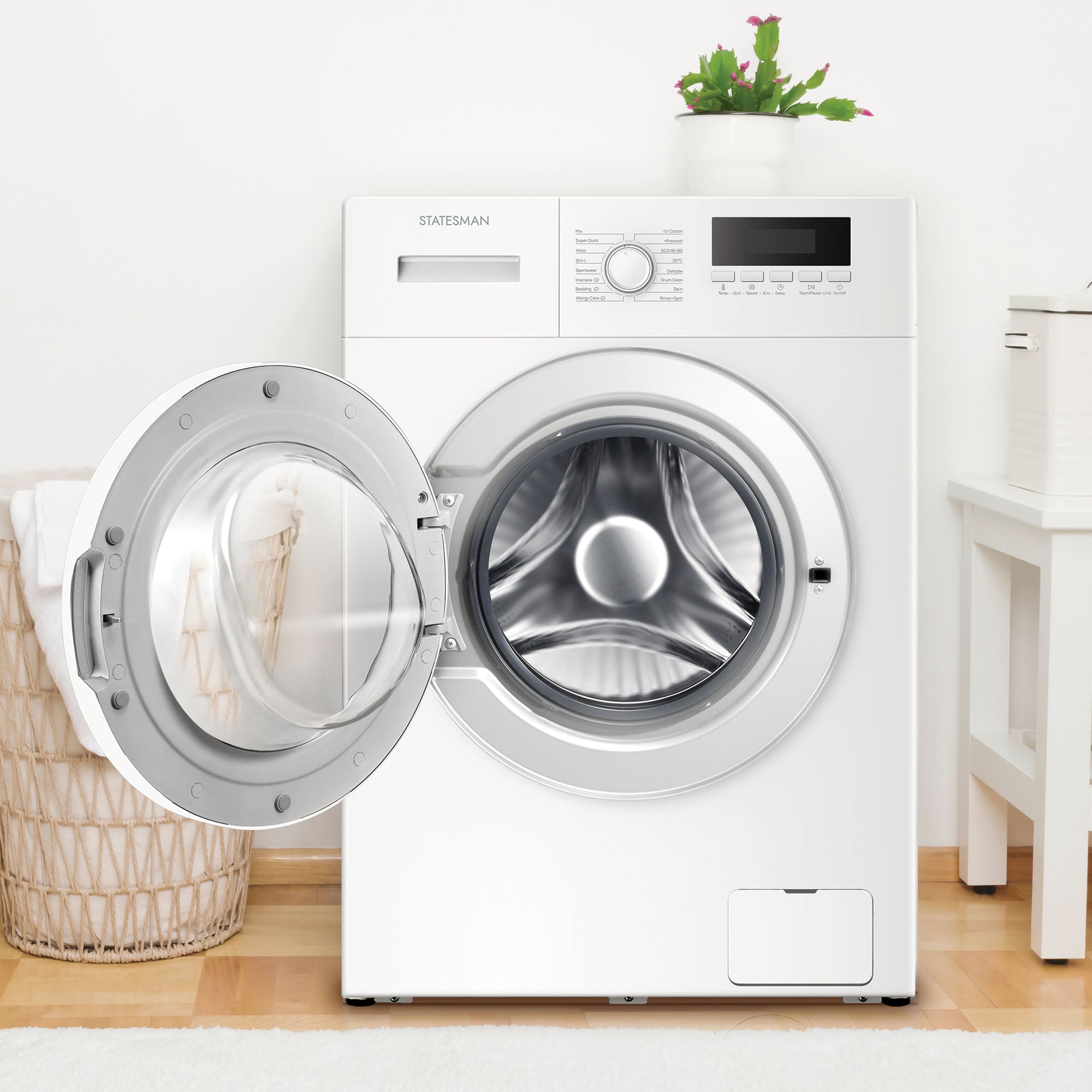 White washing machine with open door in a room with wooden floor and white walls.