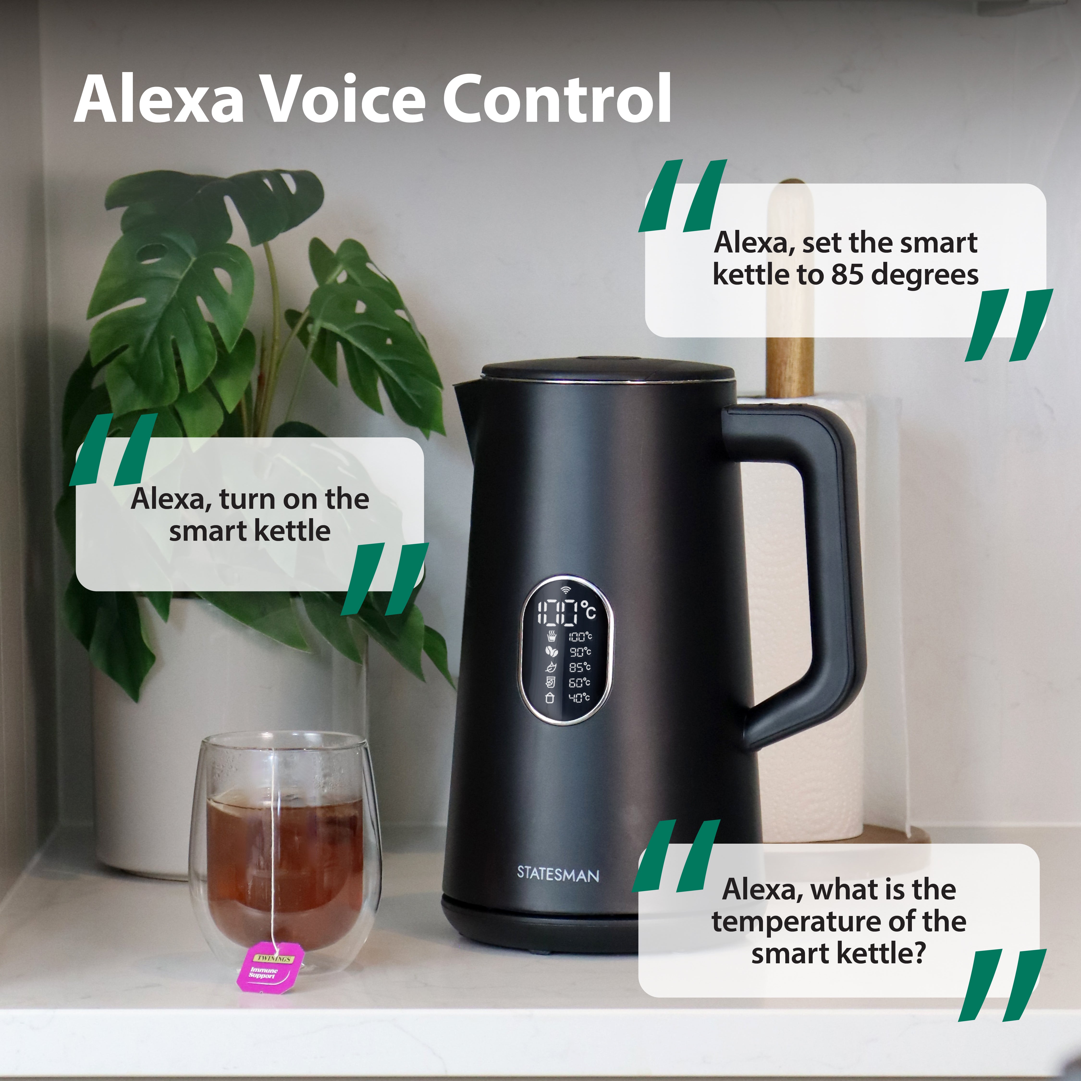 The Statesman Appliances 1.5L 1800W Smart Jug Kettle in black sits on a countertop beside a glass of tea and plant, with Alexa-compatible voice commands like “Alexa, turn on the kettle” and “Alexa, set the kettle to 85 degrees.”.
