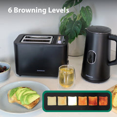 The Statesman 900W 2 Slice Digital Toaster in black by Statesman Appliances sits on a counter near avocado toast, tea, and a plant. An LED display shows 6 Browning Levels with images from light to dark toast.