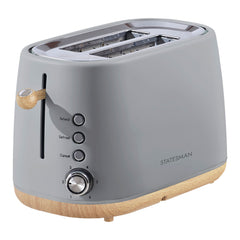 The Statesman Appliances 900W 2 Slice Scandi Toaster features a modern grey Scandi design with wood-style accents, extra-large slots, three function buttons (Reheat, Defrost, Cancel), a numbered browning dial, and brand name on the side.