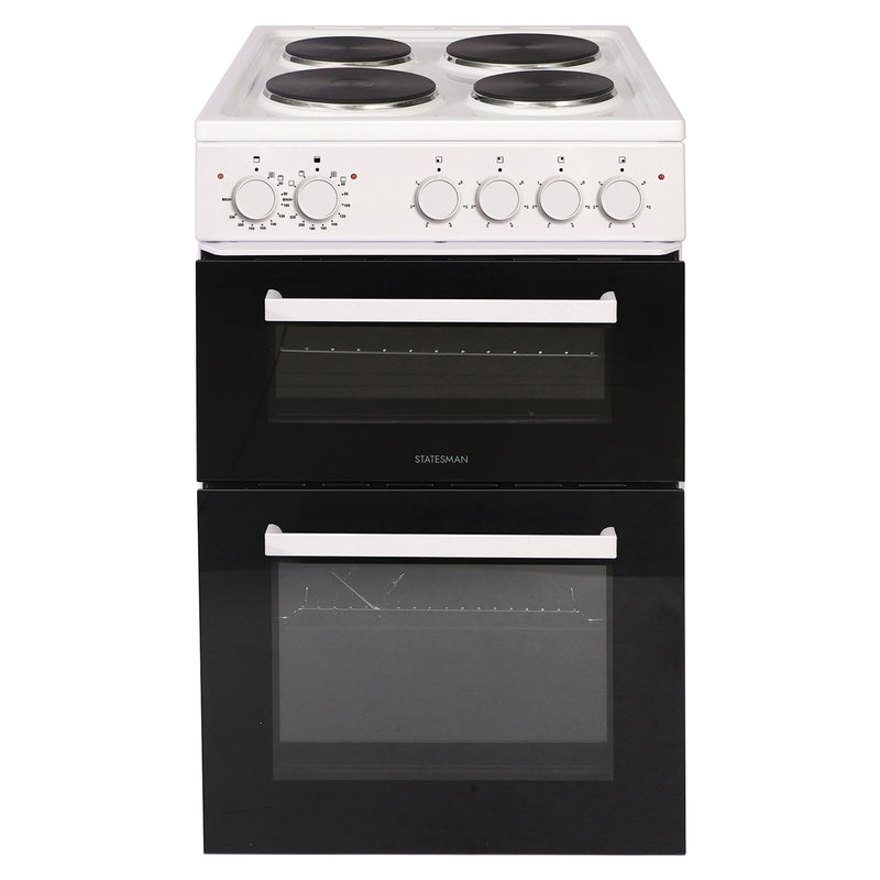 The Statesman Twin Cavity Electric Cooker is a 50cm wide, white freestanding appliance featuring a solid plate hob with four black hotplates, five control knobs, and two vertically aligned black front oven doors with white handles. This model also offers a separate grill for enhanced cooking versatility.