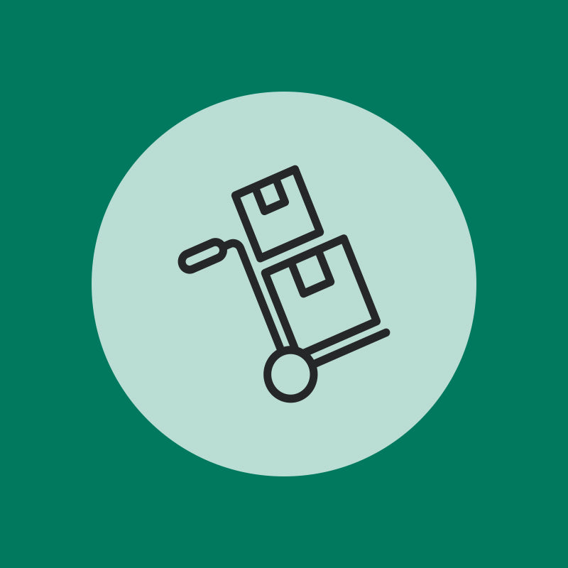 A simple black line drawing of a hand truck with two stacked boxes, centered on a light green circle with dark green background, representing "Installation" by Addons.